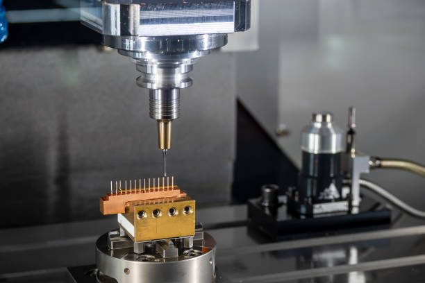 istock The CNC milling machine cutting the copper electrode parts with solid ball end mill. 1427243691