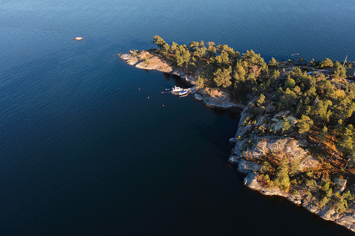 An island in the Värmdö municipality in the Stockholm archipelago, with a few boats moored at a jetty.