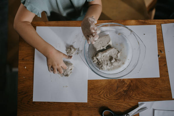 istock Girl playing with clay 1427245769