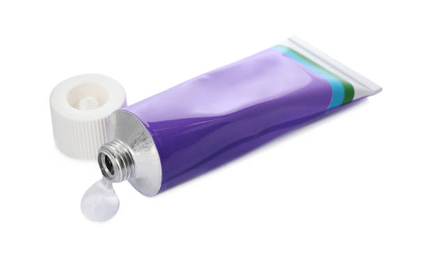 istock Open tube with ointment on white background 1427246204
