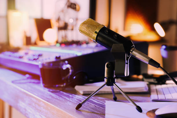 istock Microphone near professional mixing console on table in radio studio 1427246254