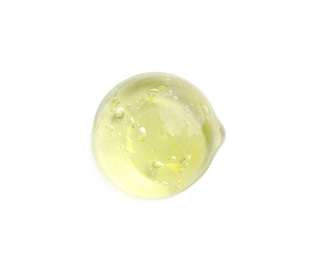 istock Drop of yellow ointment on white background, top view 1427246297