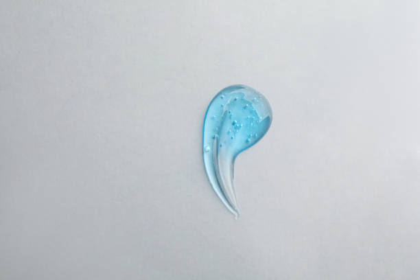 istock Smear of ointment on grey background, top view 1427246553