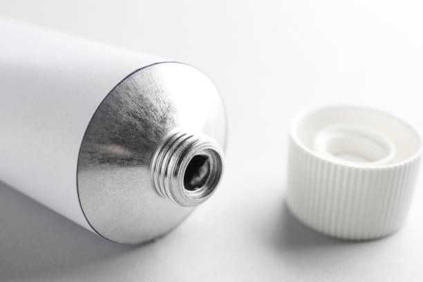 istock Open ointment tube on white background, closeup 1427246554