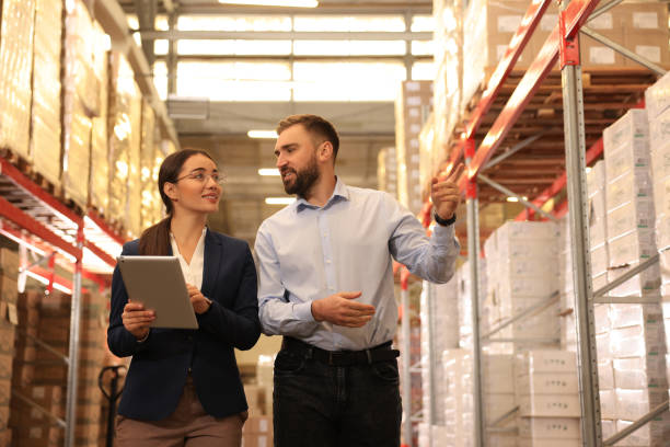 istock Manager and supervisor at warehouse. Logistics center 1427246807
