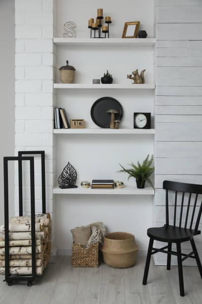 istock Many shelves with different decor in room. Interior design 1427247799