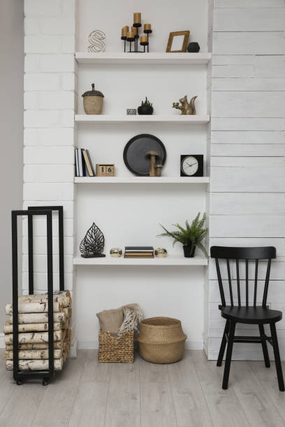 istock Many shelves with different decor in room. Interior design 1427248441