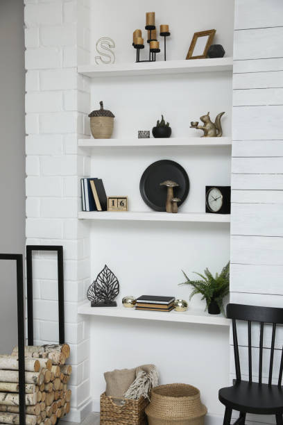 istock Many shelves with different decor in room. Interior design 1427248640