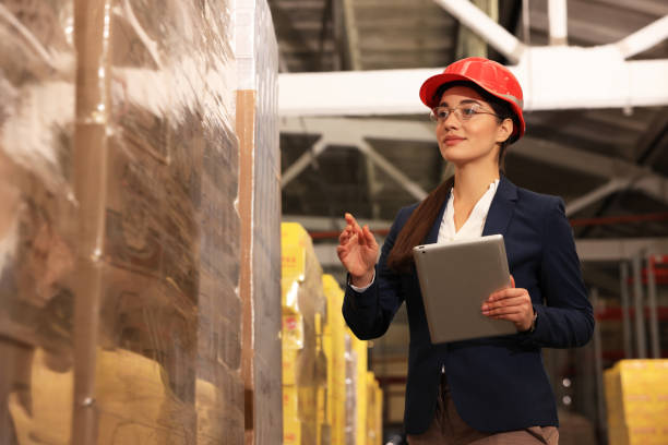 istock Manager with tablet working at warehouse. Logistics center 1427248700