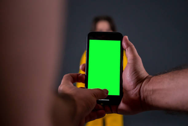 istock smart phone is in man hand focus on foreground retailing horizontal photo 1427249881