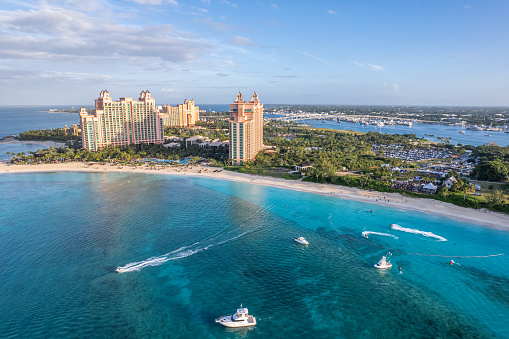 Paradise Island sits just offshore from the island of New Providence in the Bahamas. Two bridges connect to the city of Nassau,over Nassau Harbour.