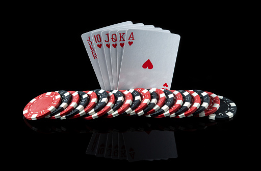Poker cards with five of a kind the highest combination. Close-up of playing cards and chips in poker club. Free advertising space