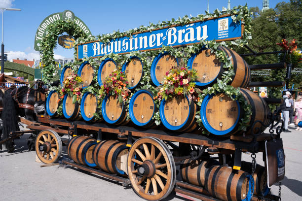 wooden augustiner-braeu beer barrels at oktoberfest 2022 in munich, germany - oktoberfest imagens e fotografias de stock