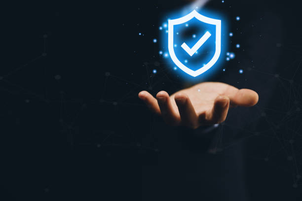 istock Businessman holding a shield icon with a tick mark. computer data password protection concept internet network security Cyber ​​digital technology. Business data and virus protection 1427259410