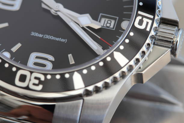 Diver watch with a metal bracelet a noble diving watch with metal bracelet and black dial swiss watches stock pictures, royalty-free photos & images