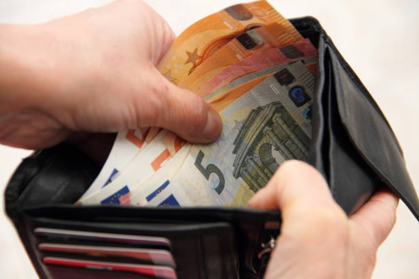 istock an opened purse with euro bills 1427260957