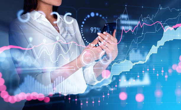 istock Businesswoman using phone, stock market graph chart with forex diagrams 1427264821