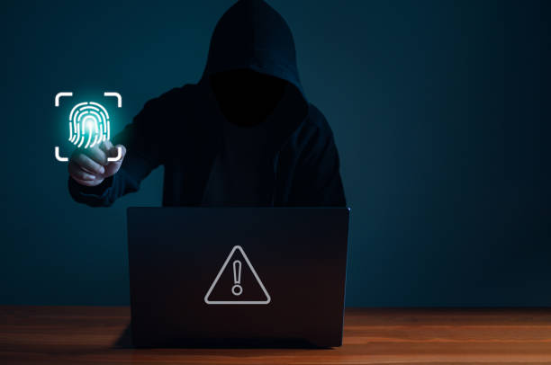 istock Hackers work on laptops in the dark. The concept of information security in the Internet network and information espionage. 1427269418