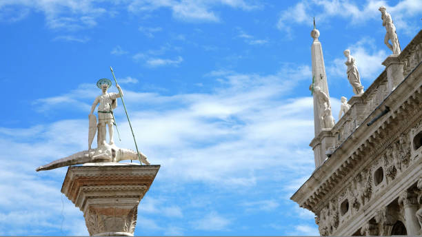 istock VENICE, ITALY - JULY 7, 2018: ancient columns, monuments, ancient architecture of Venice, against the blue sky, on a hot summer day, Piazza San Marco, St Mark's Basilica, 1427271174