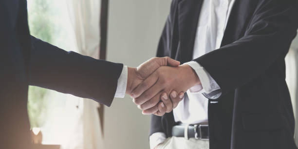 istock Two confident business man shaking hands during a meeting in the office, success, dealing, greeting and partner concept. 1427273457