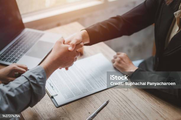 Business Negotiations Real Estate Agents Women Shaking Hands With Clients After Signing Property Sales Contracts Giving Advice Passing Bank Approvals And Installments Concept New House Moving House Stock Photo - Download Image Now