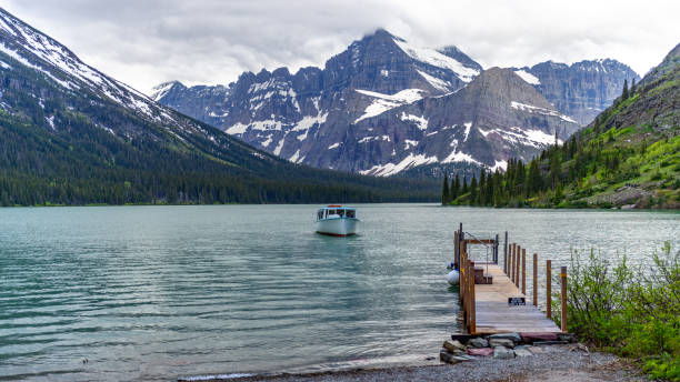 istock Glacier National Park with lake, mountains, and boat 1427276228