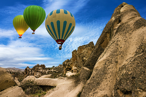 Hot air balloons in rock landscape. Cappadocia, Turkey. Goreme national park.