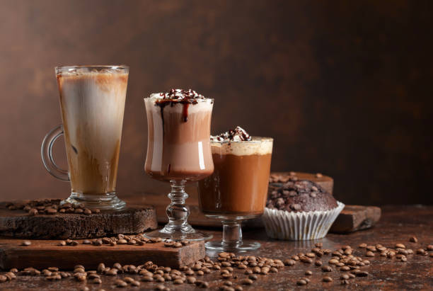 Chocolate muffin and coffee cocktails. Chocolate muffin and coffee cocktails with whipped cream. cappuccino coffee froth milk stock pictures, royalty-free photos & images