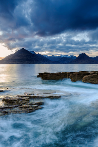 Wide angle view of dusk at dramatic Elgol Beach on The Isle of Skye, Scotland, UK.