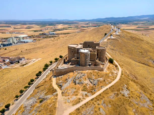 An aerial view of iconic Consuegra Castle (Spanish: Castillo de Consuegra) and famous windmills of La Mancha stock photo