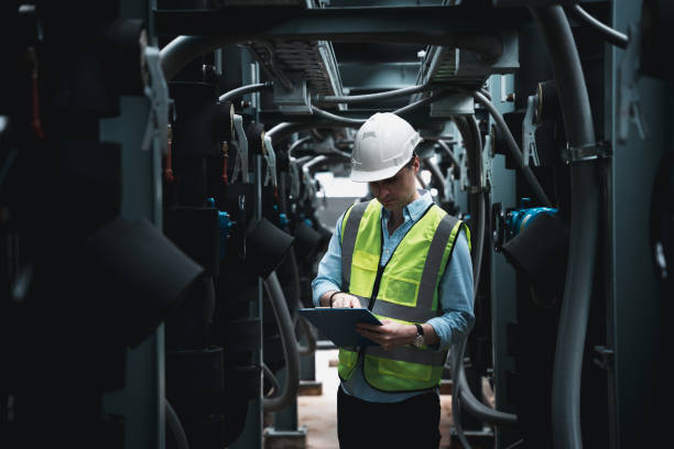 istock Engineers are inspecting a large building or industrial facility's cooling system for the air conditioning. 1427290436