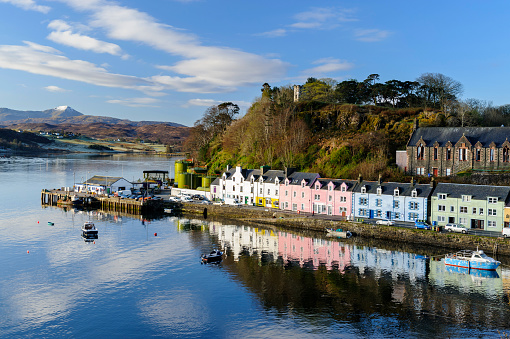 Wide angle view of the harbour and colourful buildings in Portree, Isle of Skye, Scotland, UK