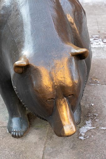 Frankfurt, Germany - February 13, 2021: The struggle between bulls and bears symbolizing rising or falling financial markets.