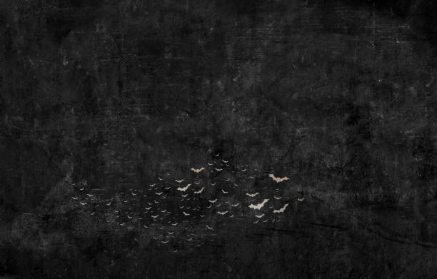 A colony of bats fly against a black grunge background.
