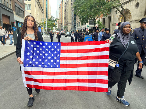 New York City, United States. 25th Sep, 2022. Flags of the United States are seen on Madison Avenue in New York City during the annual United American Muslim Day Parade.
