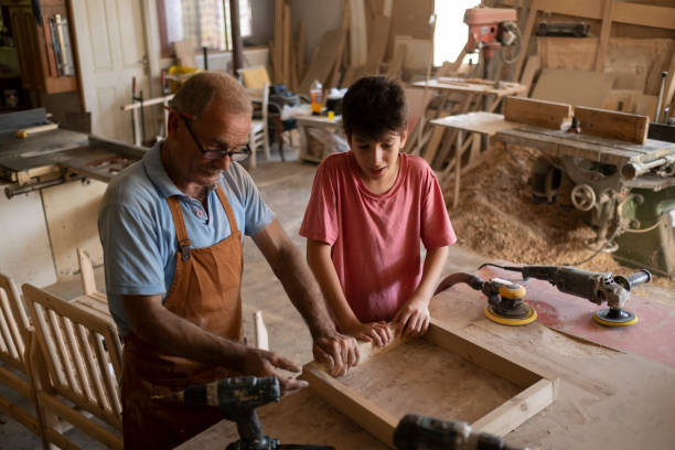 istock Grandfather and grandson in workshop 1427301516