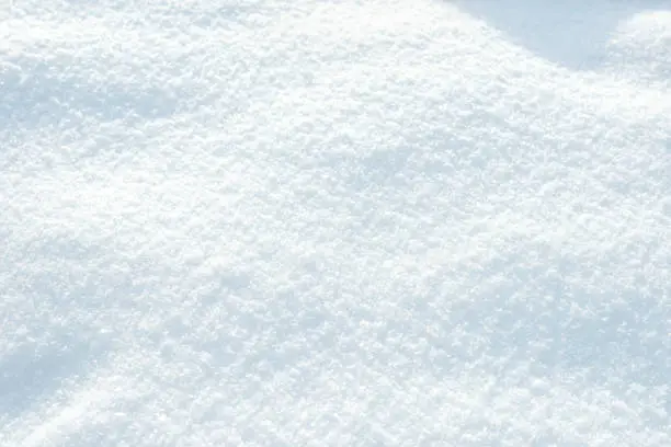 Photo of Beautiful natural background of fluffy pure snow of a bluish tint.