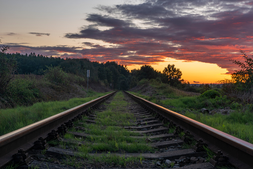 Old non electrified railway track near Rakovnik town in sunset color evening
