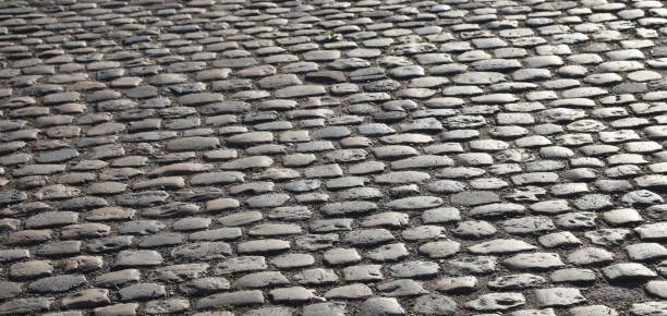 istock road pavement made with many smooth pebbles without people 1427308029