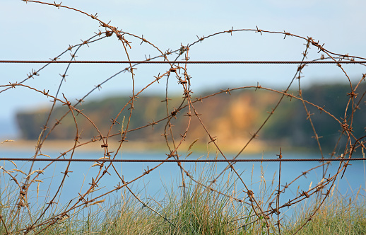 metal barbed wire of World War II protection in the Normandy landing beaches.
