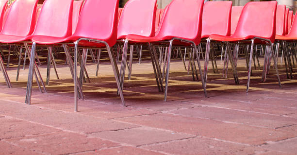 istock empty red plastic chairs with no people before the show 1427314397