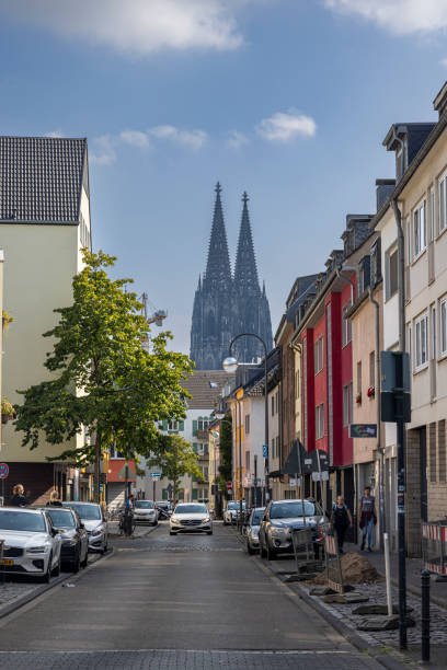 cologne cathedral famous twin towers visible all over city center - medieval autumn cathedral vertical imagens e fotografias de stock