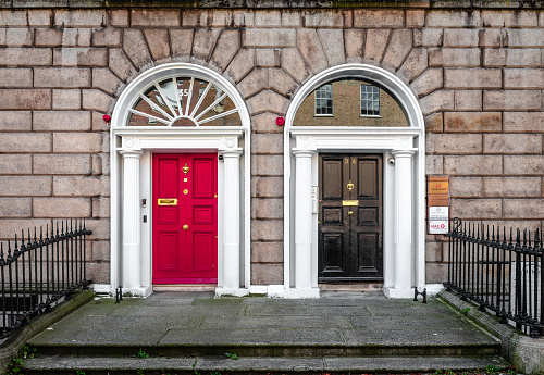 Dublin, Ireland - September 16 2022: Detail of the façade of Georgian building in Fitzwilliam pl. Colorful doors have become a trademark of the city.