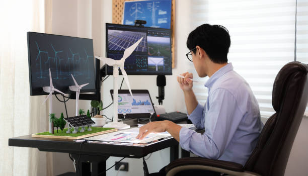 istock Young smart engineer design Green energy project, engineer design wind turbine and solar system at home , freelance engineer 1427332575