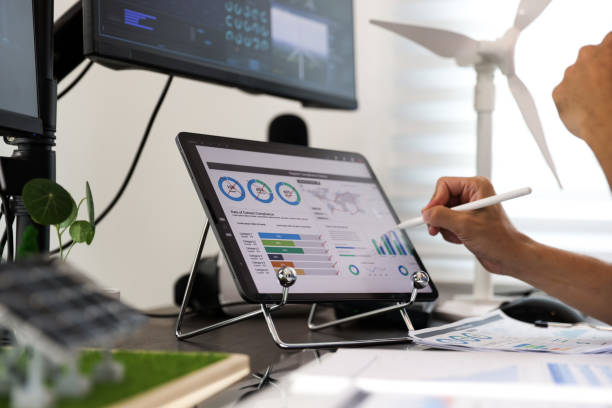istock Young smart design engineer design Green energy system , freelance engineer work at home office ,  engineer working on the wind turbines project 1427332614