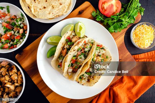 Chicken Tacos Topped With Pico De Gallo And Cheese Stock Photo - Download Image Now - Taco, Plate, High Angle View