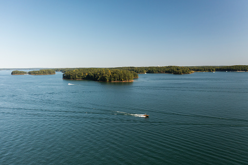 Panoramic aerial view shot by drone of a popular water reservoiur in Atlanta, GA which is also a popular destination for water sports enthusiasts.