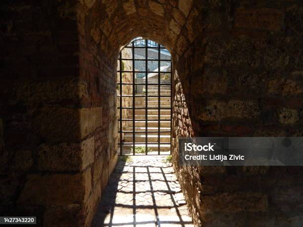 Medieval Metal Lattice Gate On Old Stone Walls Of Fortress Shadow Of Lattice Gate Kalemegdan Fortress Belgrade Stock Photo - Download Image Now