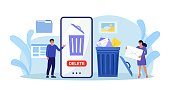 istock People cleaning mobile phone from trash files. Man and woman deleting documents with software. User removing folder with document, mail, spam to waste bin, cleansing cache 1427351860