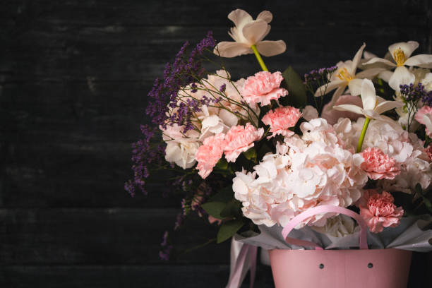 istock Beautiful flowers composition on wooden background 1427356661